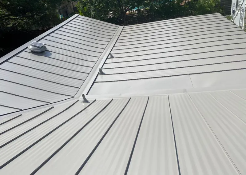 Solar attic fan installed on a metal roof for Roof Ventilation in Van Wert